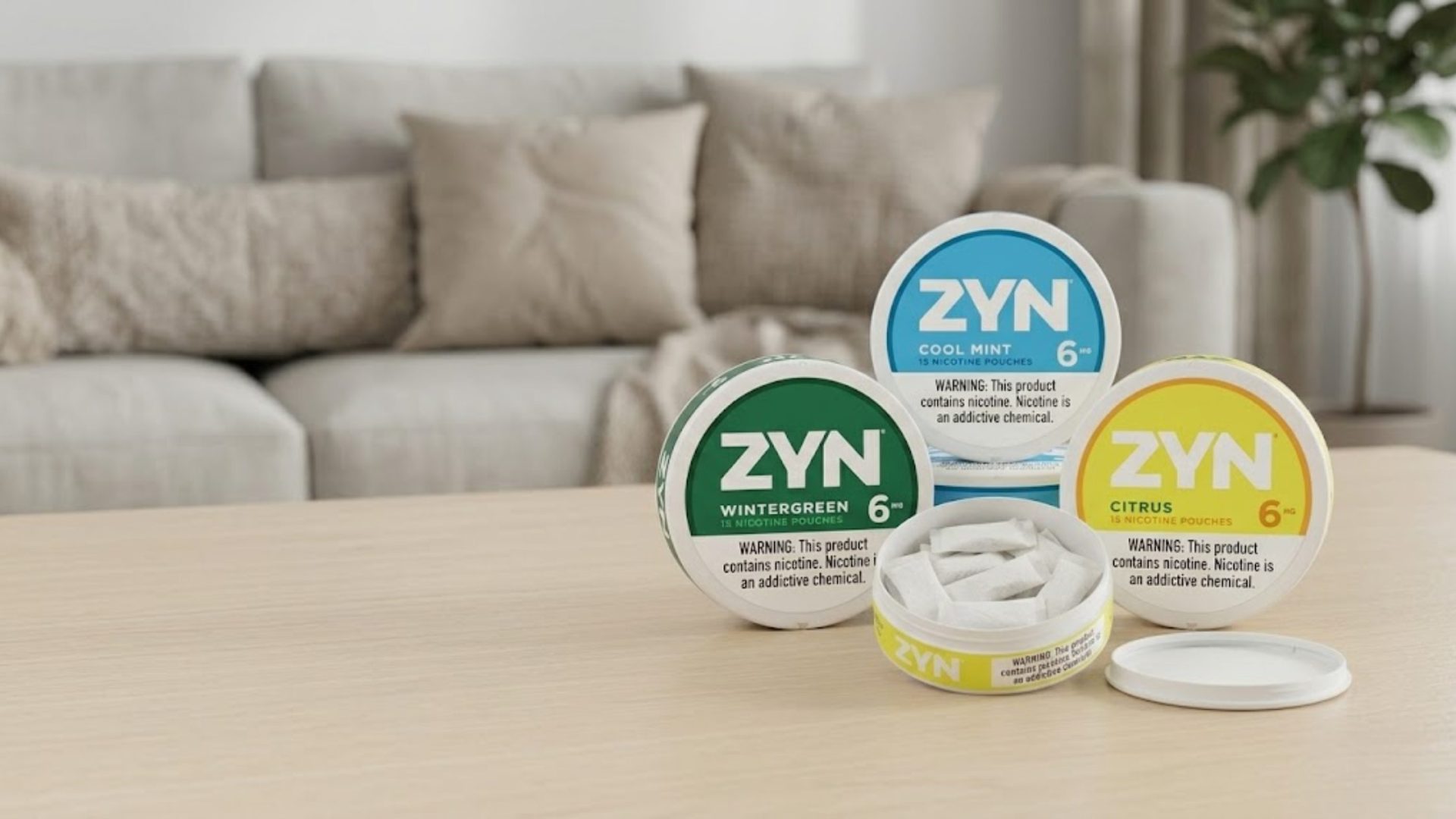 ZYN nicotine pouches in branded cans with one open can showing all-white pouches on a clean table, illustrating a discreet, tobacco-free, smokeless nicotine option for adult users.